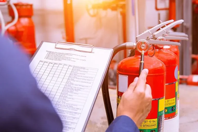 Man checking fire safety list, RTek Fire Solutions.