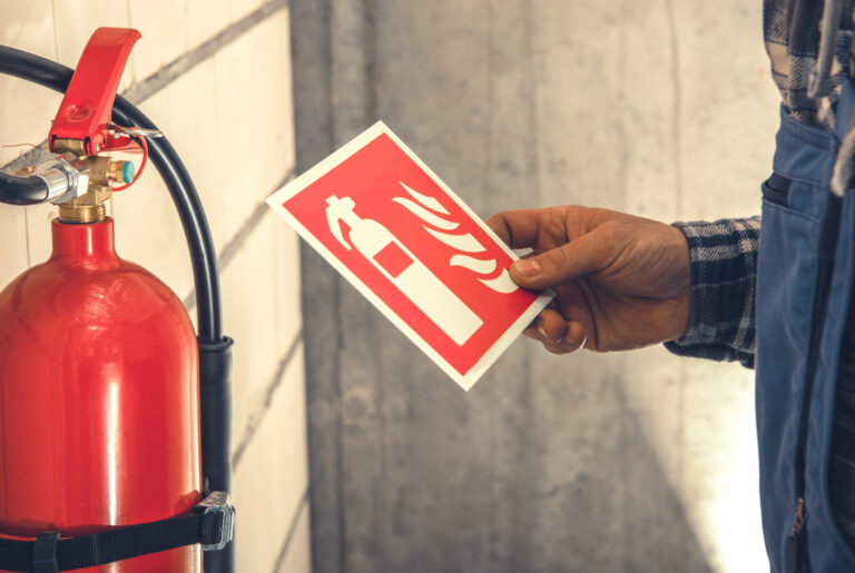 Fire extinguisher installation inside commercial building, RTek Fire Solutions.