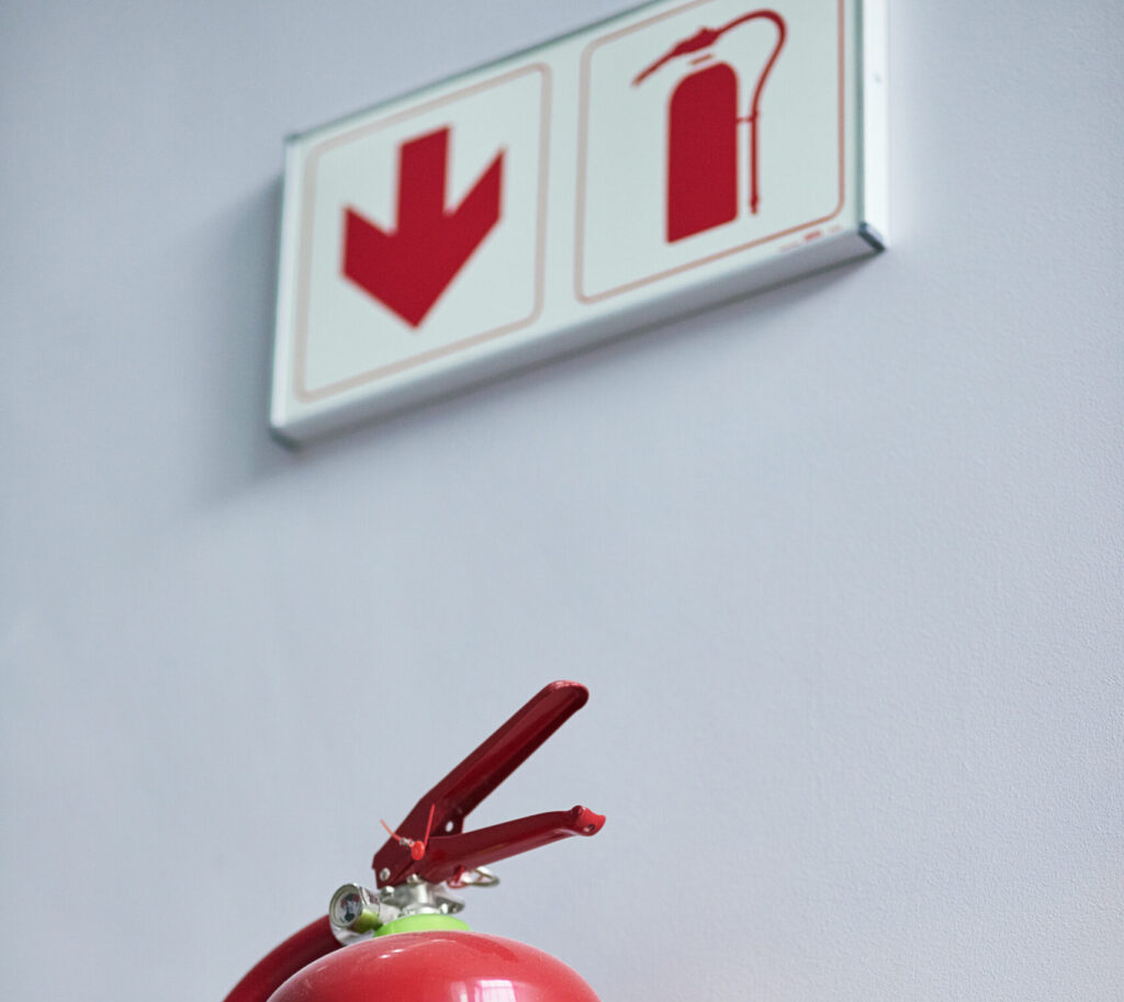 Fire extinguisher with clear sign, RTek Fire Solutions.